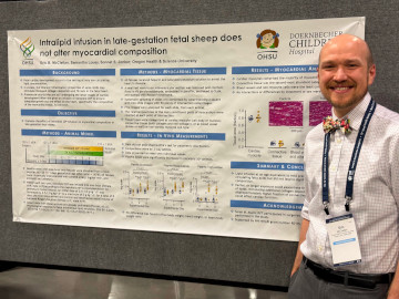 Eric McClellan with his poster at SRI 2025.